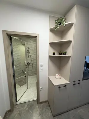 a bathroom with a shower and a sink and a toilet at Nikea apart 1 in Velingrad