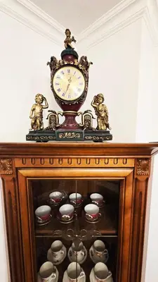 a clock sitting on top of a cabinet with balls at The Executive Escape Sofia in Sofia