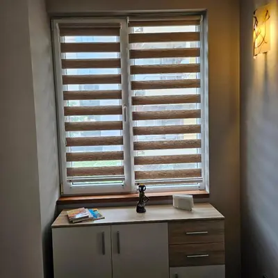 a window with wooden shutters in a room at Philipopolis Stay in Plovdiv