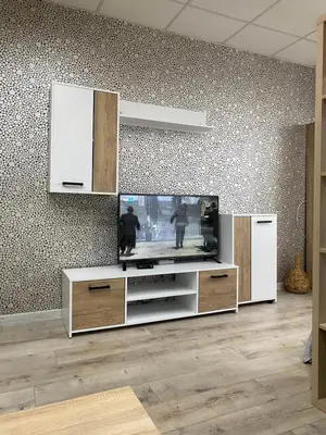 a living room with a flat screen tv at Панорама in Panagyurishte