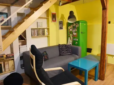 a living room with a couch and a table at Anna's downtown loft in Plovdiv