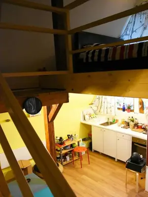 a room with a bunk bed and a kitchen at Anna's downtown loft in Plovdiv