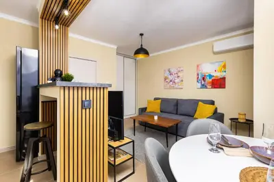 a living room with a couch and a table at Central Chic 1BD Apt Near Kapana by Flat Manager in Plovdiv
