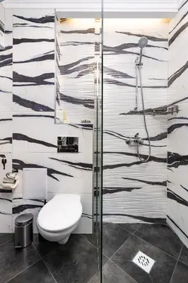 a bathroom with a toilet and a shower at Central Chic 1BD Apt Near Kapana by Flat Manager in Plovdiv