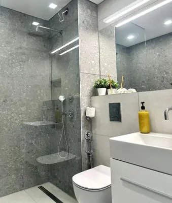 a bathroom with a shower and a toilet and a sink at Апартамент В 48 в Сграда МОНА in Sofia