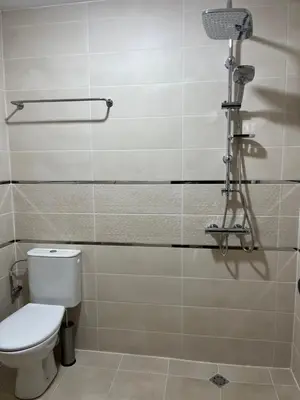 a bathroom with a toilet and a shower at Villa YoSi in Sapareva Banya