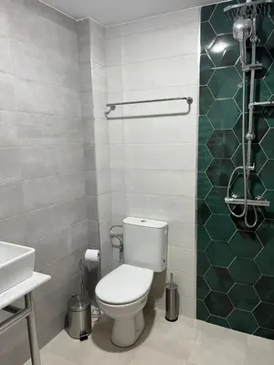 a bathroom with a toilet and a sink at Villa YoSi in Sapareva Banya