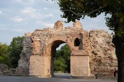an old brick building with an arch at Студио 9 Парк Панорама in Hisarya