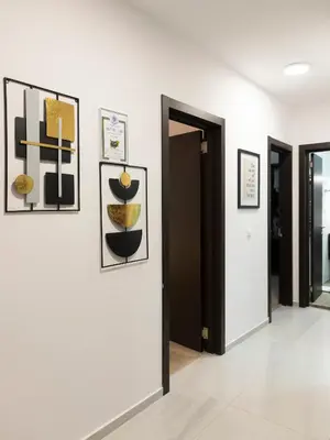 a hallway with several pictures on the wall at Casa Vista - Spacious 2BR, 2Bath, Apartment in Sofia with 2 Free Parking in Sofia