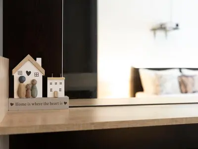 a home is where the heart is sign on a table at Casa Vista - Spacious 2BR, 2Bath, Apartment in Sofia with 2 Free Parking in Sofia