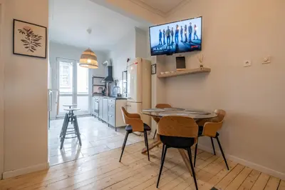 a kitchen and dining room with a table and chairs at Spacious & Central 2BR with Terrace, Cozy & Modern by Flat Mаnager in Sofia