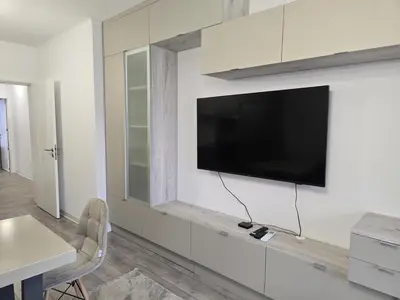 a living room with a tv on a wall at The Oligarchs Outlook in Sofia