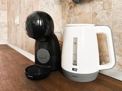 a kitchen counter with a coffee maker next to a microwave at Classic Charm - 2BD central Apartment by FlatManager in Sofia