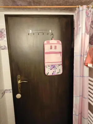a door with a pink bag hanging on it at The Bird Villa in Bosnek