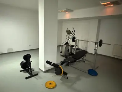 a gym with two exercise bikes and a yellow frisbee at Forest Retreat, Stream Resort, Pamporovo in Stoykite