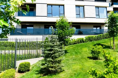 a garden in front of a building at Business Park Premium, 2B lux flat, free garage in Sofia