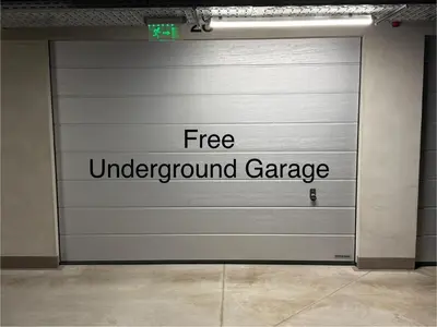 a garage door with the words free underground garage at Business Park Premium, 2B lux flat, free garage in Sofia