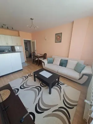 a living room with a couch and a table at Apartment-10 min from Sofia airport in Sofia