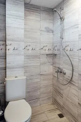 a bathroom with a toilet and a shower at Къща Инфинити Лукс и Уют, Вплетени в Спомени in Sapareva Banya