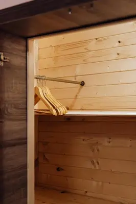 a sauna with a wooden wall in a cabin at Апартамент Инфинити in Sapareva Banya