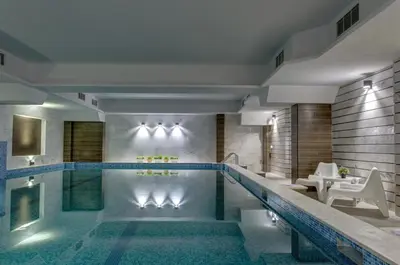 a pool in a hotel room with a swimming pool at Hotel Monte Cristo in Blagoevgrad