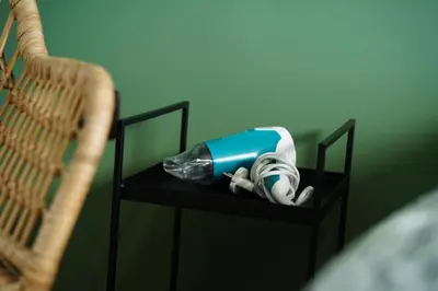 a blow dryer sitting on a shelf next to two baskets at NDK Skyline Studio in Sofia