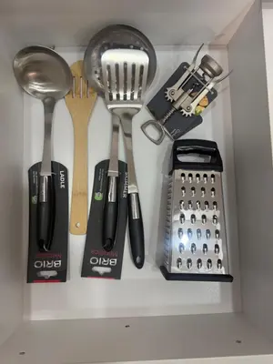 a drawer filled with kitchen utensils in a drawer at White lux in Sandanski