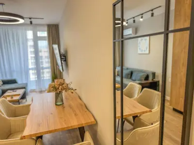 a dining room with a table and chairs at 1BR Apartment with a Free Designated Parking Space in Plovdiv