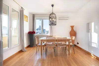 a dining room with a table and chairs at Roca House in Sofia