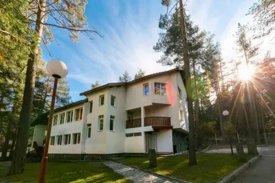a house with the sun shining on it at Вилно селище Тракия- почивка сред природата in Tsigov Chark
