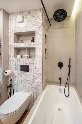 a white bathroom with a tub and a toilet at Arte Apartment in Sofia