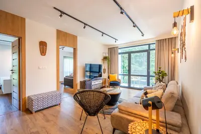 a living room with a couch and a table at Arte Apartment in Sofia