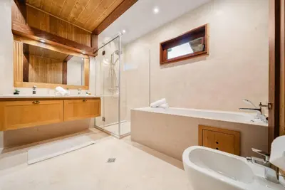 a bathroom with a tub and a sink and a shower at Luxury Mountain Villa Pirin Golf K29H02 by Top Kvartiri Ltd in Razlog