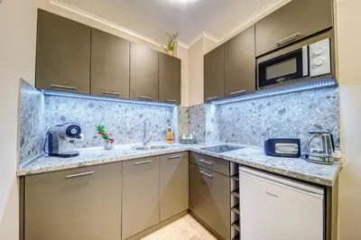 a kitchen with a sink and a microwave at Dream View 1BD - Quick Slope Access by Flat Manager in Pamporovo