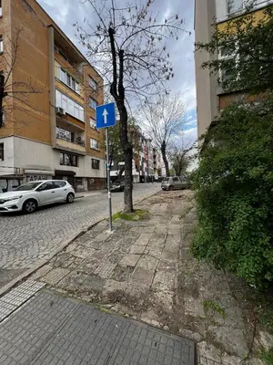 a blue sign on the side of a street at Sofia Harmony Apartment in Sofia