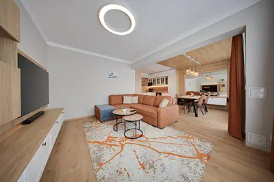 a living room with a couch and a table at Miro's Central Apartment in Sofia