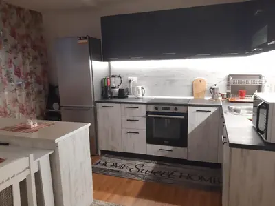 a kitchen with a stove and a refrigerator at Дом Борисови in Sofia