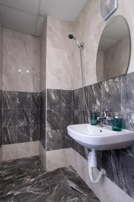 a bathroom with a sink and a mirror at Villa Veselina Loft Studios in Hisarya