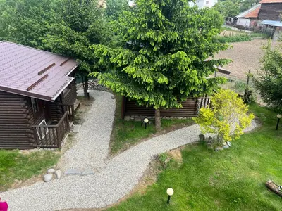 an aerial view of a garden with a cabin at Guest House Raffe in Dobrinishte