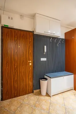 a kitchen with a wooden door and a counter at Marble place in Sofia