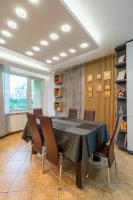 a dining room with a table and chairs at Marble place in Sofia