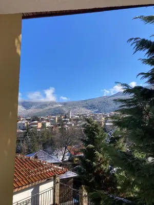 a view of a city from a window at Къща за гости Рупчос 1 in Smolyan