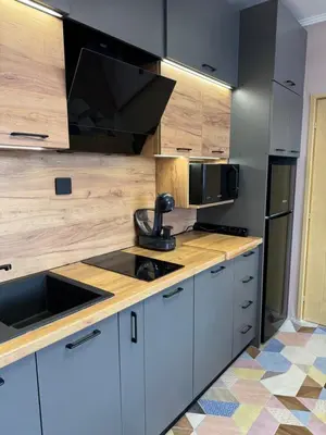 a kitchen with a sink and a microwave at VeliApartmets in Velingrad