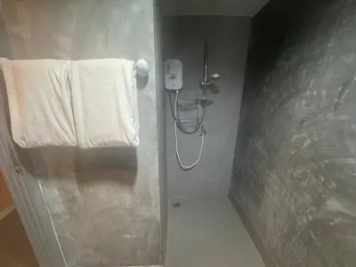 a bathroom with a shower with a phone on the wall at Ski Retreat Spa Pool and Mountain Views in Bansko