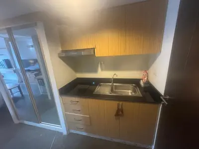 a small kitchen with a sink and a shower at Ski Retreat Spa Pool and Mountain Views in Bansko