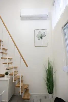 a staircase in a white room with a plant at Free parking, Close to Subway, Central location in Sofia