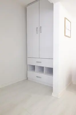 a white room with a white cabinet and a white floor at Free parking, Close to Subway, Central location in Sofia