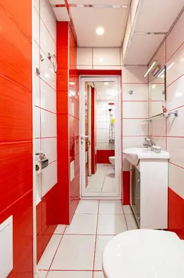 a bathroom with red and white walls and a sink at 1BD Flat in Plovdiv - 25 min Walk from the Centre by Flat Mаnаger in Plovdiv