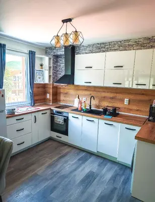 a kitchen with white cabinets and a sink at Апартамент Петя 2 in Velingrad