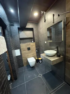 a bathroom with a sink and a toilet in it at Апартамент Петя 2 in Velingrad